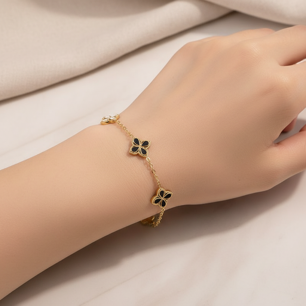 Clover bracelet on model's wrist