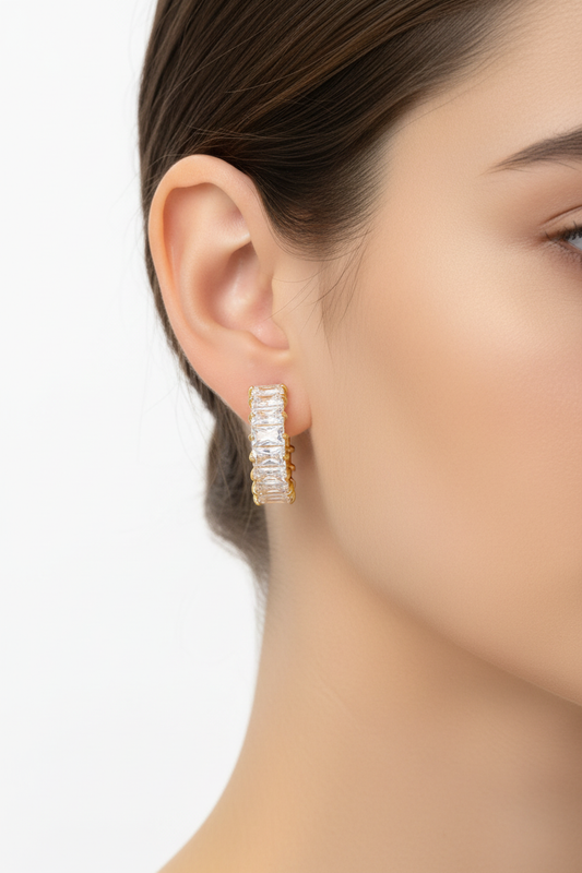 Model wearing crystal baguette hoop earrings - 21mm gold plated